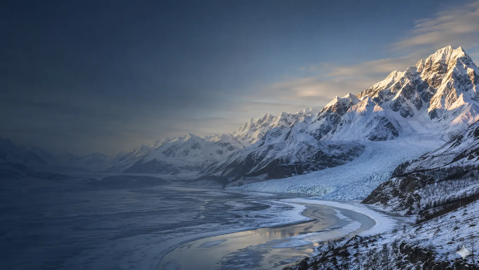 Snow-covered Alaska mountains and glacier valley